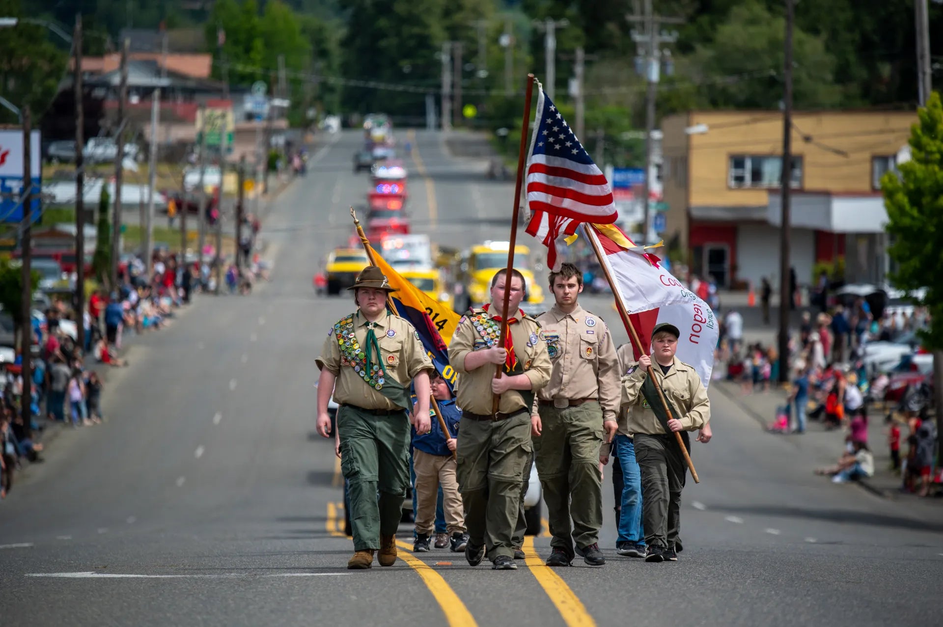 Boy scouts carrying flags in the parade
